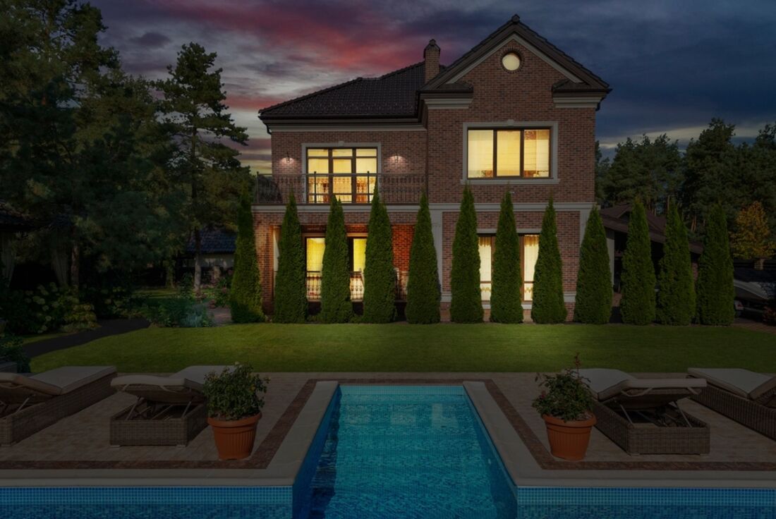A backyard pool at dusk